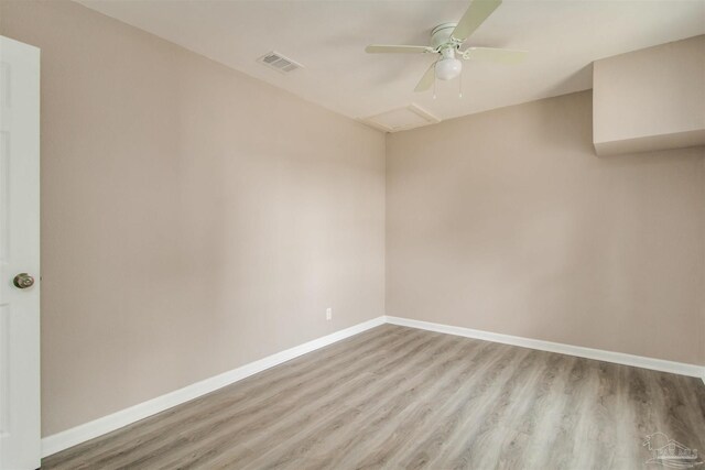 2511 Green Village Rd, Walnut Hill, FL 32568 - spare room with a ceiling fan, visible vents, baseboards, attic access, and light wood-style floors