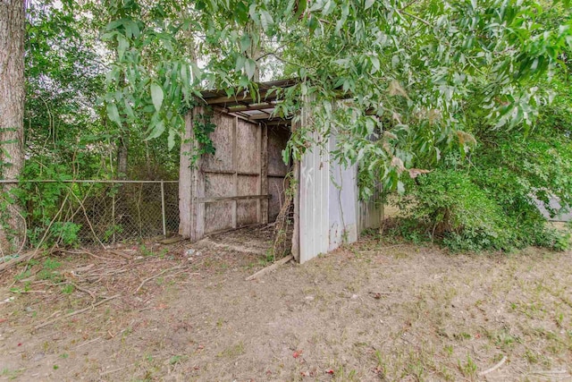 2511 Green Village Rd, Walnut Hill, FL 32568 - view of shed featuring fence