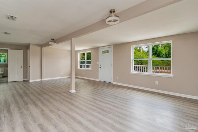 2511 Green Village Rd, Walnut Hill, FL 32568 - unfurnished living room featuring baseboards, visible vents, and light wood-type flooring