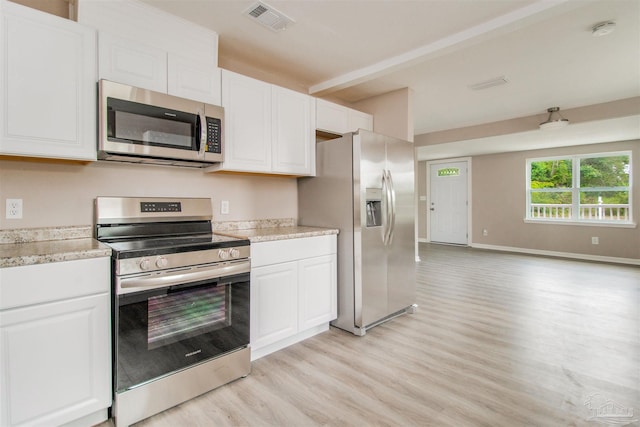2511 Green Village Rd, Walnut Hill, FL 32568 - kitchen with visible vents, baseboards, light wood-style flooring, appliances with stainless steel finishes, and white cabinetry