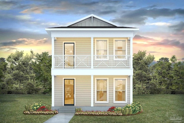 1360 W Government St, Pensacola, FL 32502 - view of front of property with board and batten siding, a front yard, and a balcony