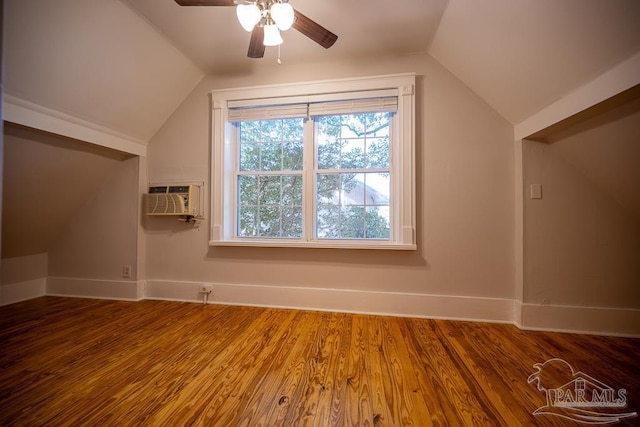 bonus room with lofted ceiling, ceiling fan, a wall mounted AC, and hardwood / wood-style floors