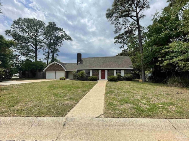 single story home with a chimney, concrete driveway, an attached garage, and a front yard