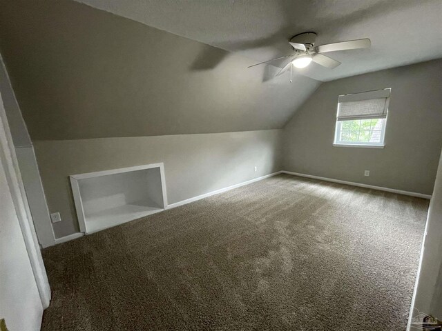 bonus room with a ceiling fan, vaulted ceiling, carpet, and baseboards
