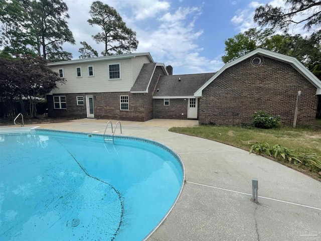 swimming pool with a patio area