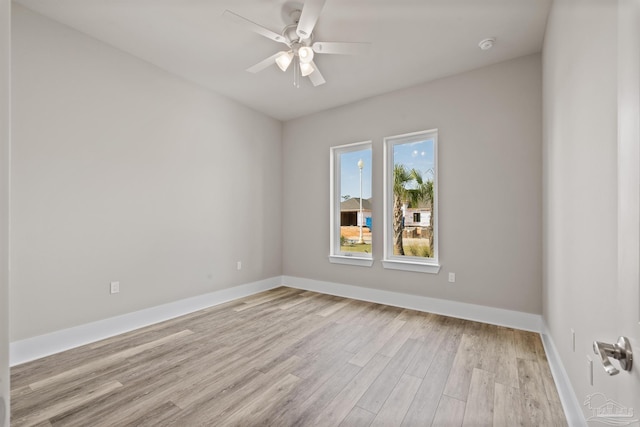 empty room featuring ceiling fan and light hardwood / wood-style floors