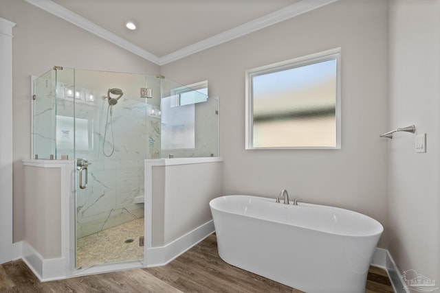 bathroom with independent shower and bath, crown molding, vaulted ceiling, and hardwood / wood-style floors