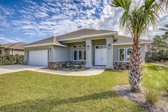 view of front facade featuring a garage and a front yard