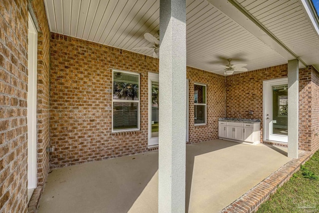 view of patio / terrace featuring ceiling fan