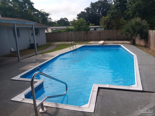 view of swimming pool featuring central air condition unit