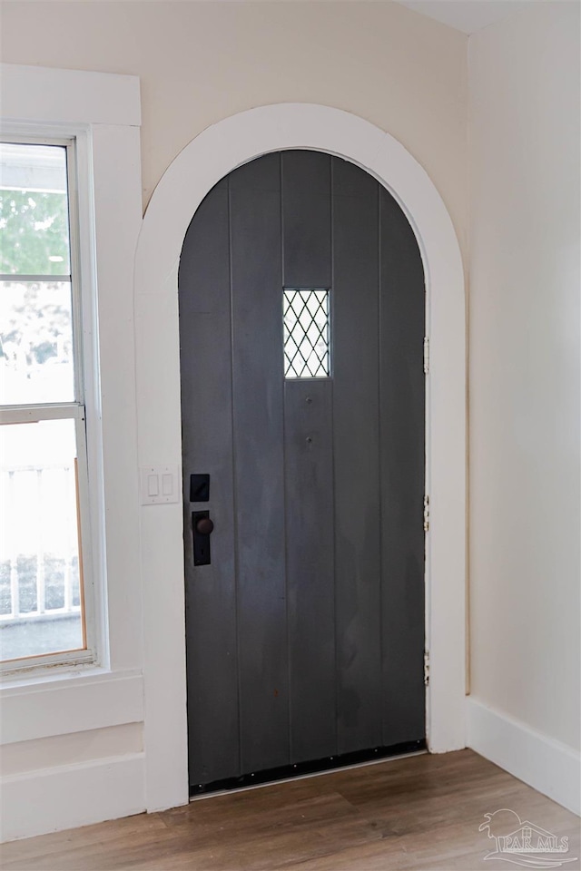 foyer entrance with hardwood / wood-style flooring