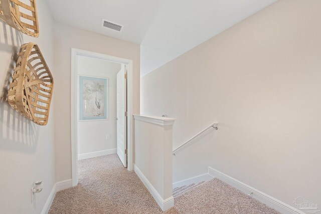 hallway with light carpet