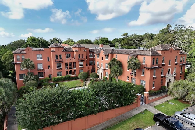 2007 E Gadsden St Unit 102, Pensacola, FL 32501 - view of apartment building / complex featuring uncovered parking