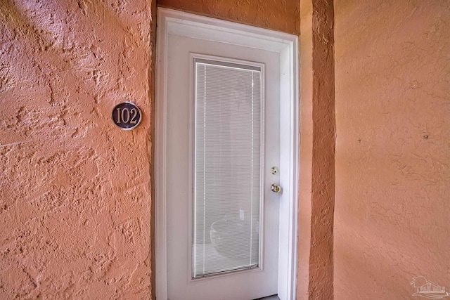2007 E Gadsden St Unit 102, Pensacola, FL 32501 - doorway to property with stucco siding
