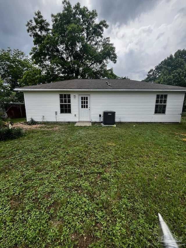 1984 Hillary Thompson Rd, Milton, FL 32570 - rear view of house with a yard and central air condition unit