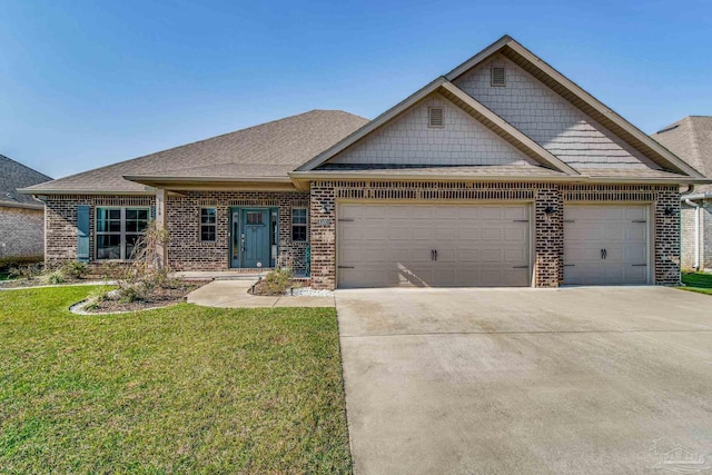 craftsman inspired home featuring a front yard and a garage