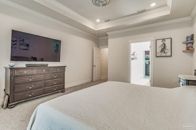 carpeted bedroom featuring a raised ceiling and ornamental molding