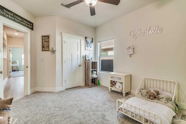 bedroom with ceiling fan and carpet floors