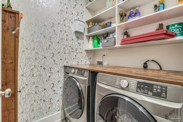 washroom with washer and dryer