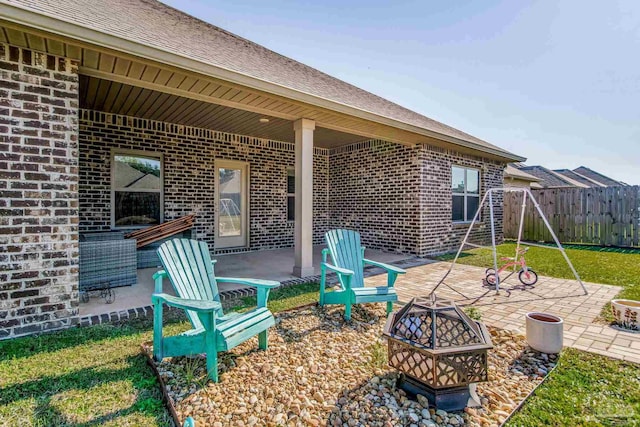 view of patio featuring an outdoor fire pit