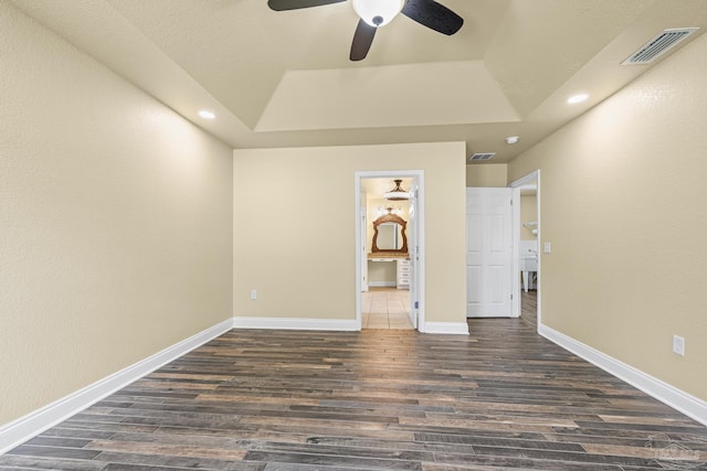8114 Silver Maple Dr, Milton, FL 32583 - unfurnished bedroom with dark wood-type flooring, a tray ceiling, recessed lighting, and a ceiling fan