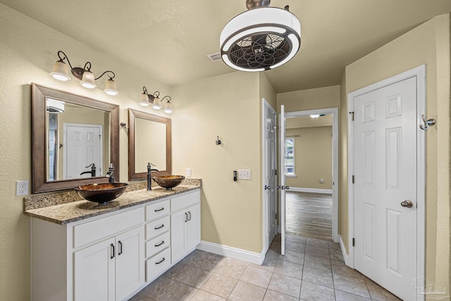8114 Silver Maple Dr, Milton, FL 32583 - bathroom featuring double vanity and tile patterned flooring