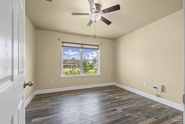8114 Silver Maple Dr, Milton, FL 32583 - spare room featuring dark wood-style floors and ceiling fan