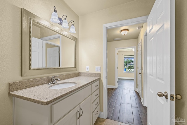 8114 Silver Maple Dr, Milton, FL 32583 - bathroom with vanity and baseboards