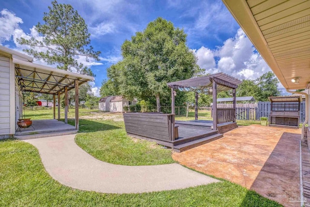 8114 Silver Maple Dr, Milton, FL 32583 - view of yard with a pergola, a wooden deck, a storage shed, and a patio area