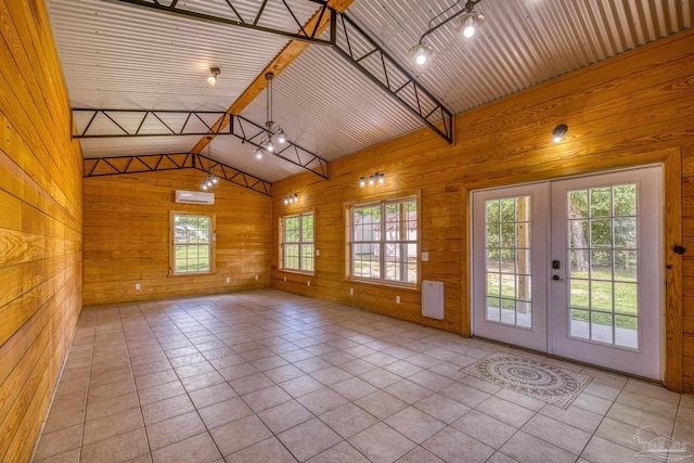 8114 Silver Maple Dr, Milton, FL 32583 - spare room with french doors, wooden walls, and tile patterned floors