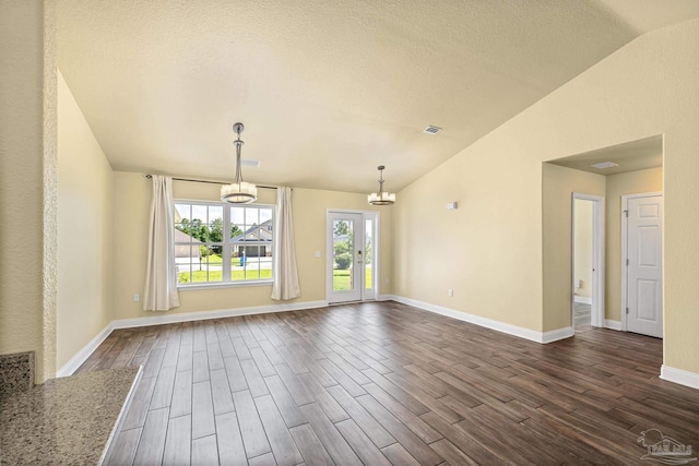 8114 Silver Maple Dr, Milton, FL 32583 - unfurnished room featuring vaulted ceiling, a chandelier, dark wood-style floors, and a textured ceiling