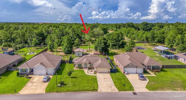 8114 Silver Maple Dr, Milton, FL 32583 - aerial perspective of suburban area with a forest