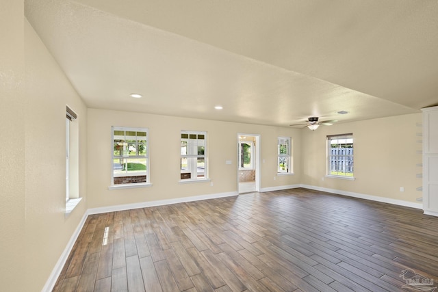 8114 Silver Maple Dr, Milton, FL 32583 - unfurnished living room featuring dark wood-style floors, a ceiling fan, and recessed lighting