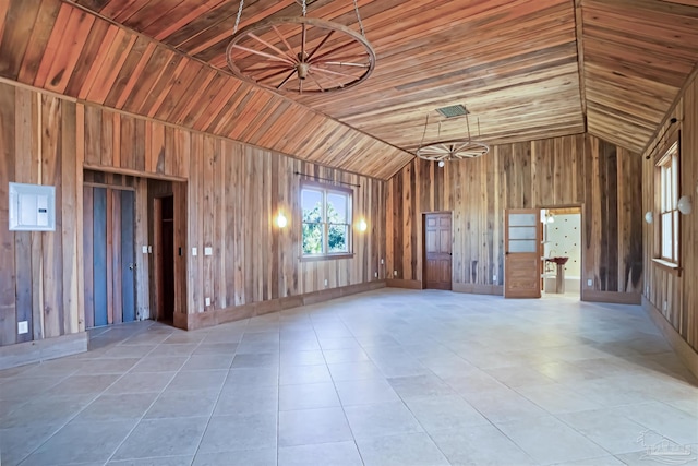 tiled empty room featuring wooden ceiling, vaulted ceiling, and wooden walls