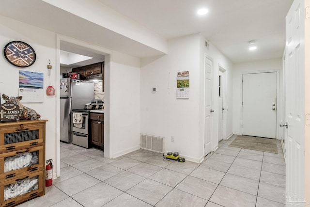 8140 Lillian Hwy, Pensacola, FL 32506 - hallway with light tile patterned floors, recessed lighting, and baseboards