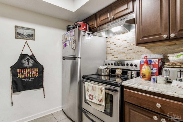8140 Lillian Hwy, Pensacola, FL 32506 - kitchen featuring under cabinet range hood, stainless steel range with electric stovetop, light tile patterned floors, backsplash, and light stone countertops