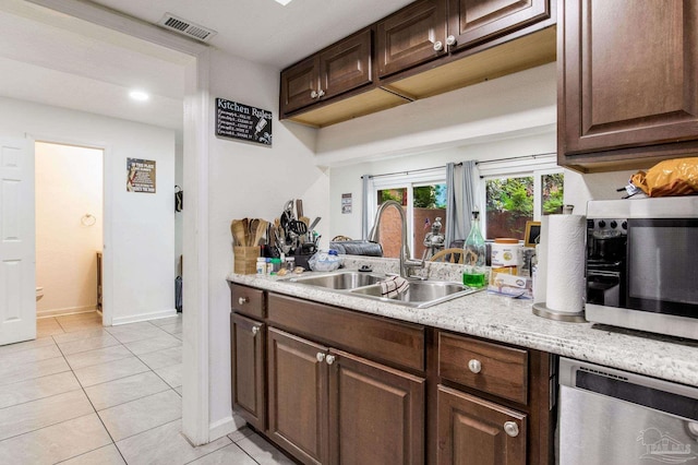 8140 Lillian Hwy, Pensacola, FL 32506 - kitchen with appliances with stainless steel finishes, a sink, light countertops, and baseboards