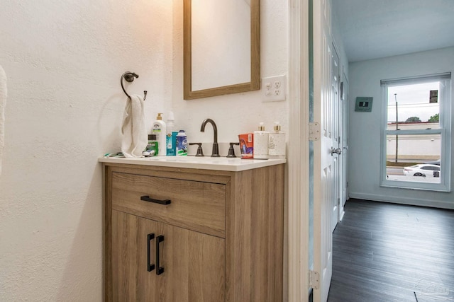 8140 Lillian Hwy, Pensacola, FL 32506 - bathroom with vanity, wood finished floors, and a textured wall