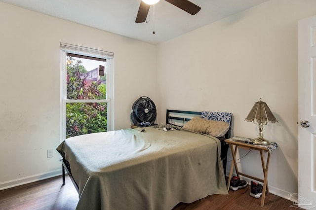 8140 Lillian Hwy, Pensacola, FL 32506 - bedroom featuring baseboards, wood finished floors, and a ceiling fan