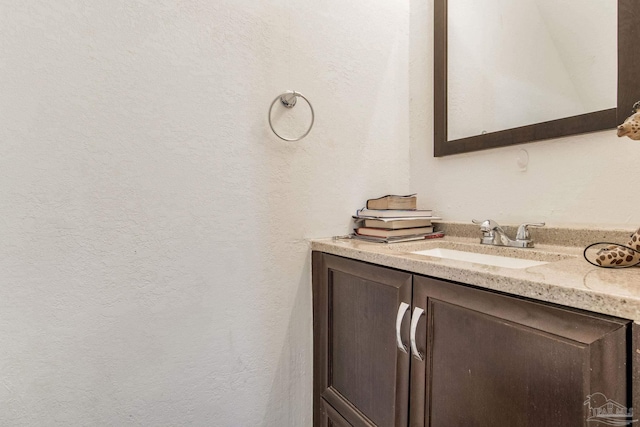8140 Lillian Hwy, Pensacola, FL 32506 - bathroom featuring vanity and a textured wall