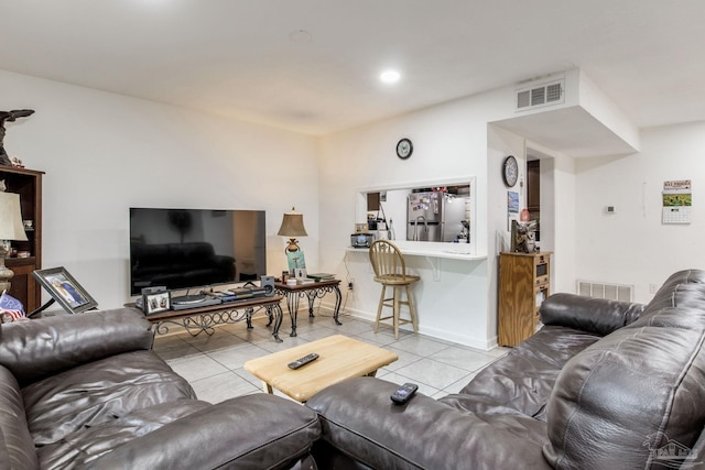 8140 Lillian Hwy, Pensacola, FL 32506 - living area featuring light tile patterned flooring and baseboards