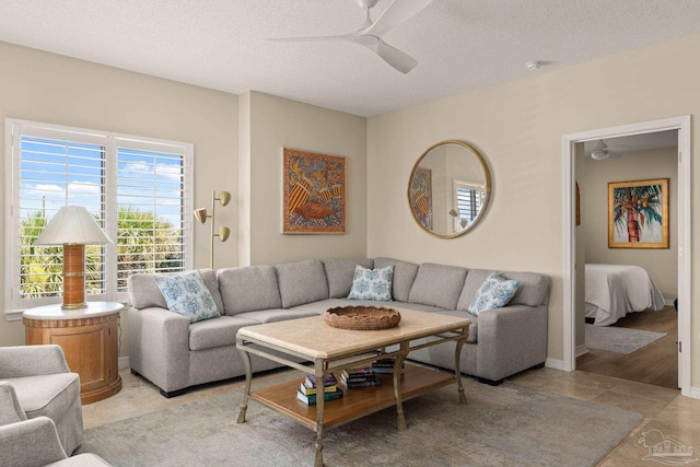 751 Pensacola Beach Blvd Unit 2F, Pensacola Beach, FL 32561 - living area featuring a ceiling fan, healthy amount of natural light, and a textured ceiling
