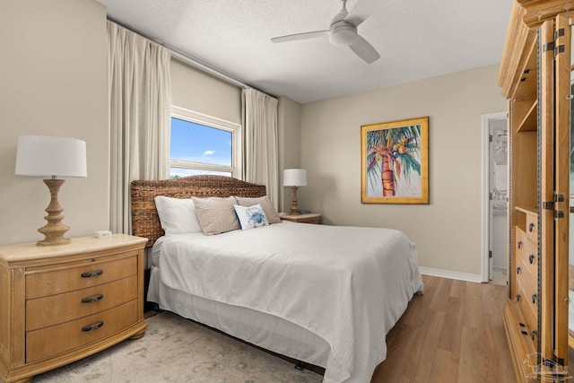 751 Pensacola Beach Blvd Unit 2F, Pensacola Beach, FL 32561 - bedroom featuring light wood-type flooring, ceiling fan, and a textured ceiling