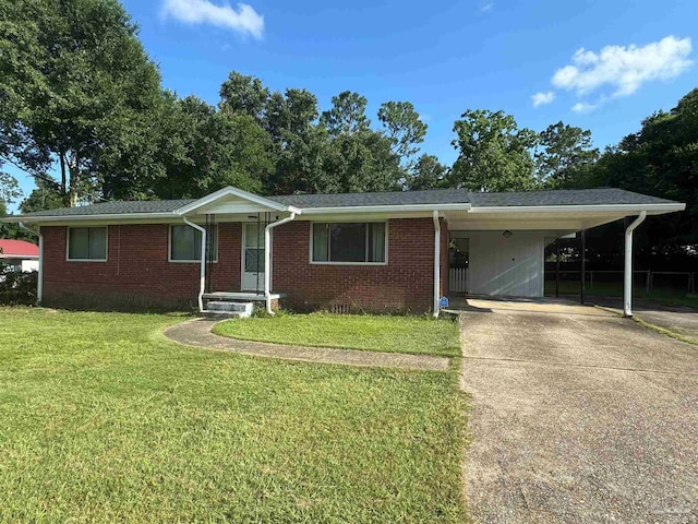 ranch-style home featuring a carport and a front yard