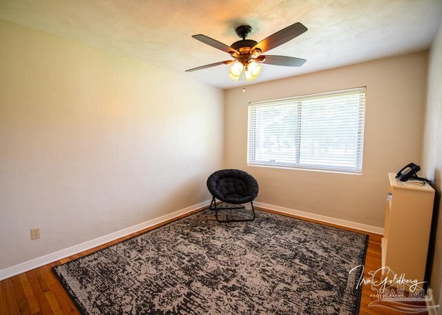 empty room featuring hardwood / wood-style floors and ceiling fan