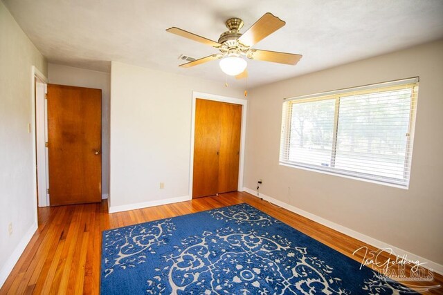 bedroom featuring light hardwood / wood-style floors and ceiling fan