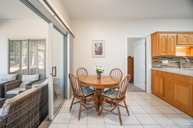 tiled dining room with sink