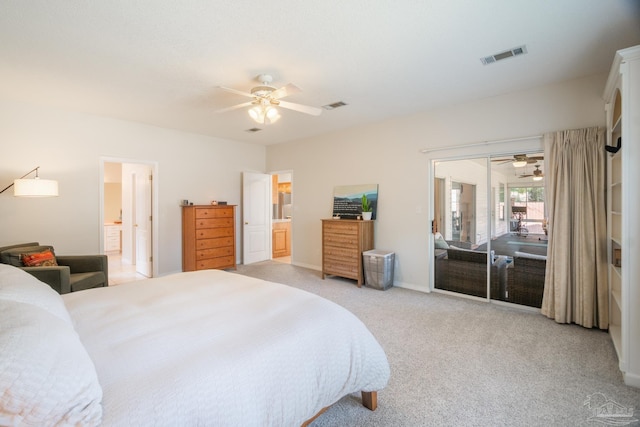 carpeted bedroom featuring ceiling fan and ensuite bathroom