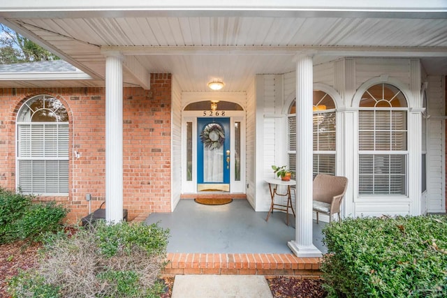 entrance to property featuring a porch