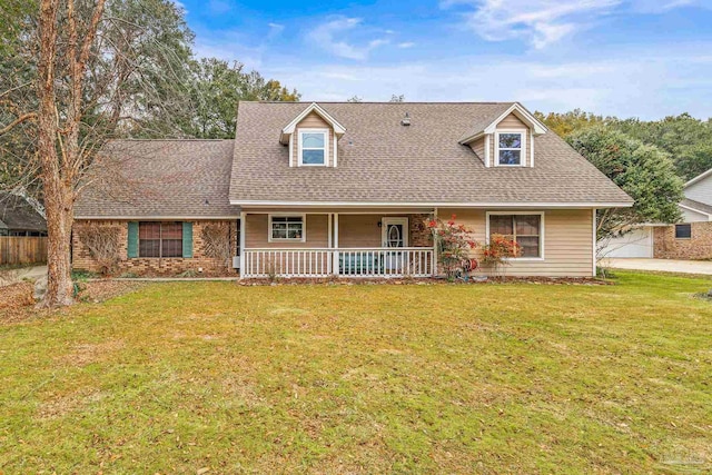 cape cod-style house featuring a porch and a front lawn